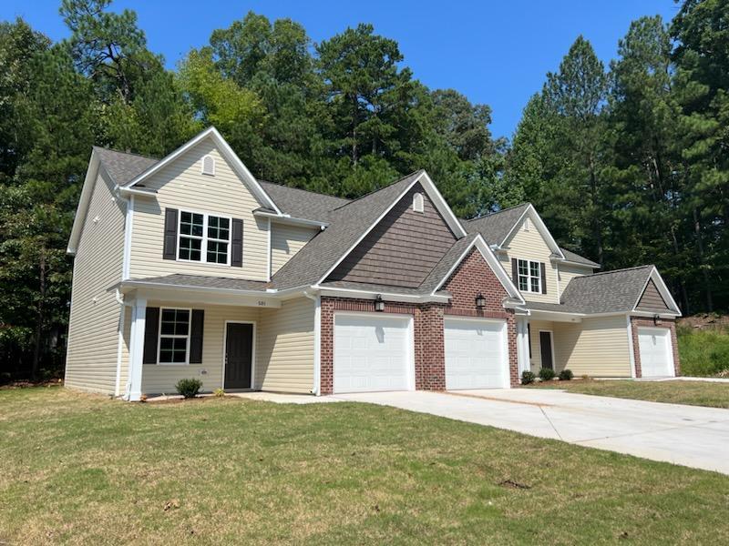 front view of a house with a yard