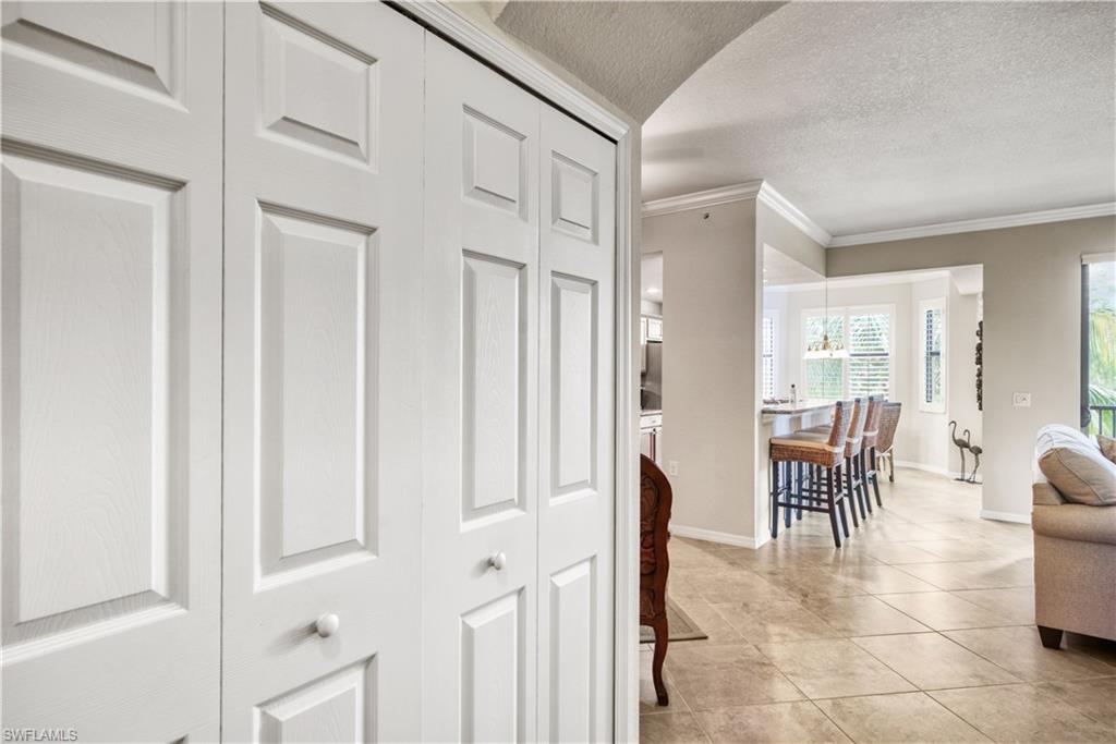 a dining room with furniture and a view of kitchen