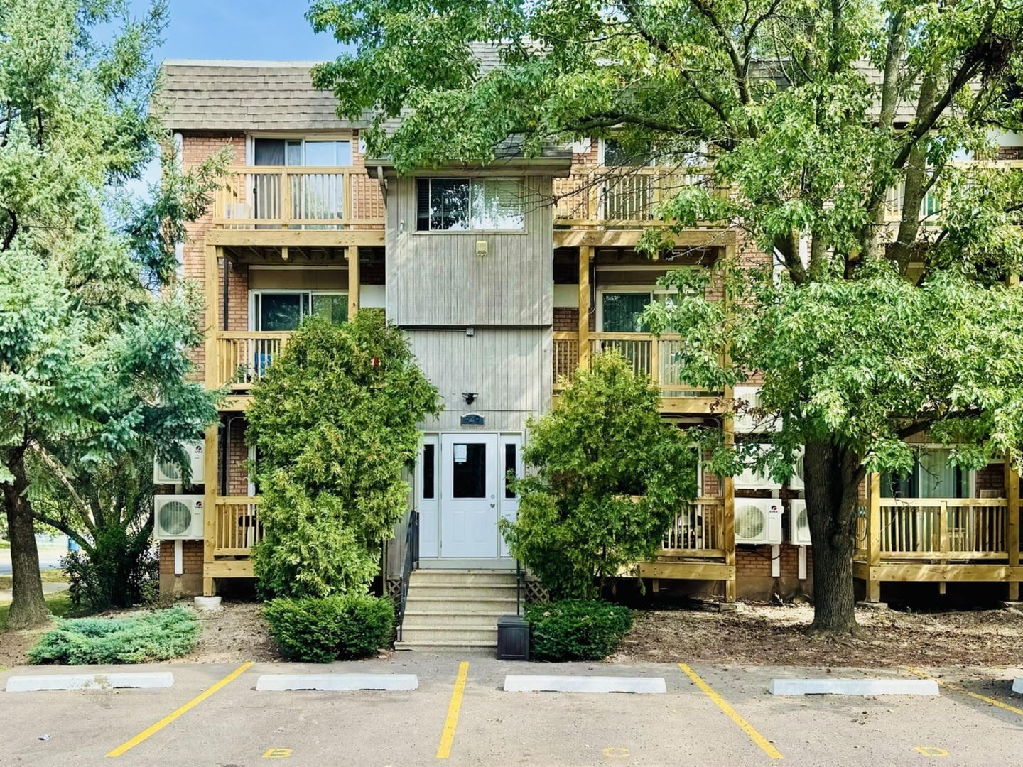 front view of a house with a tree