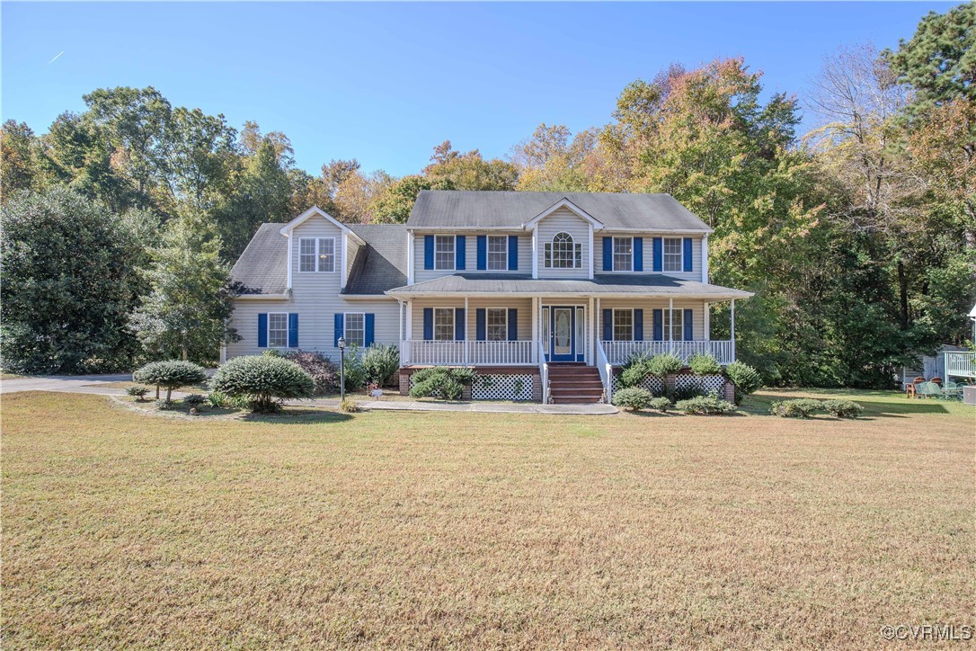 Colonial house with a porch and a front lawn