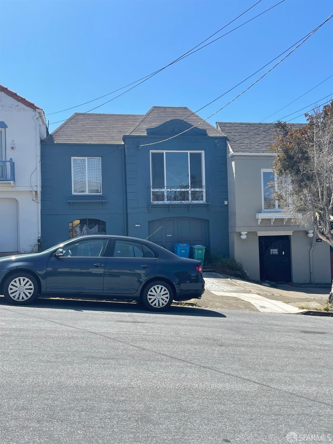 a car parked in front of a house