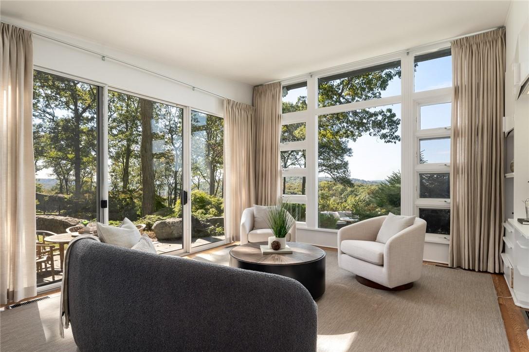 a living room with couch and a large window