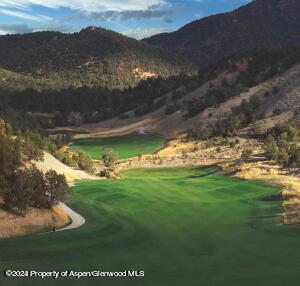 a view of a golf course with a lake