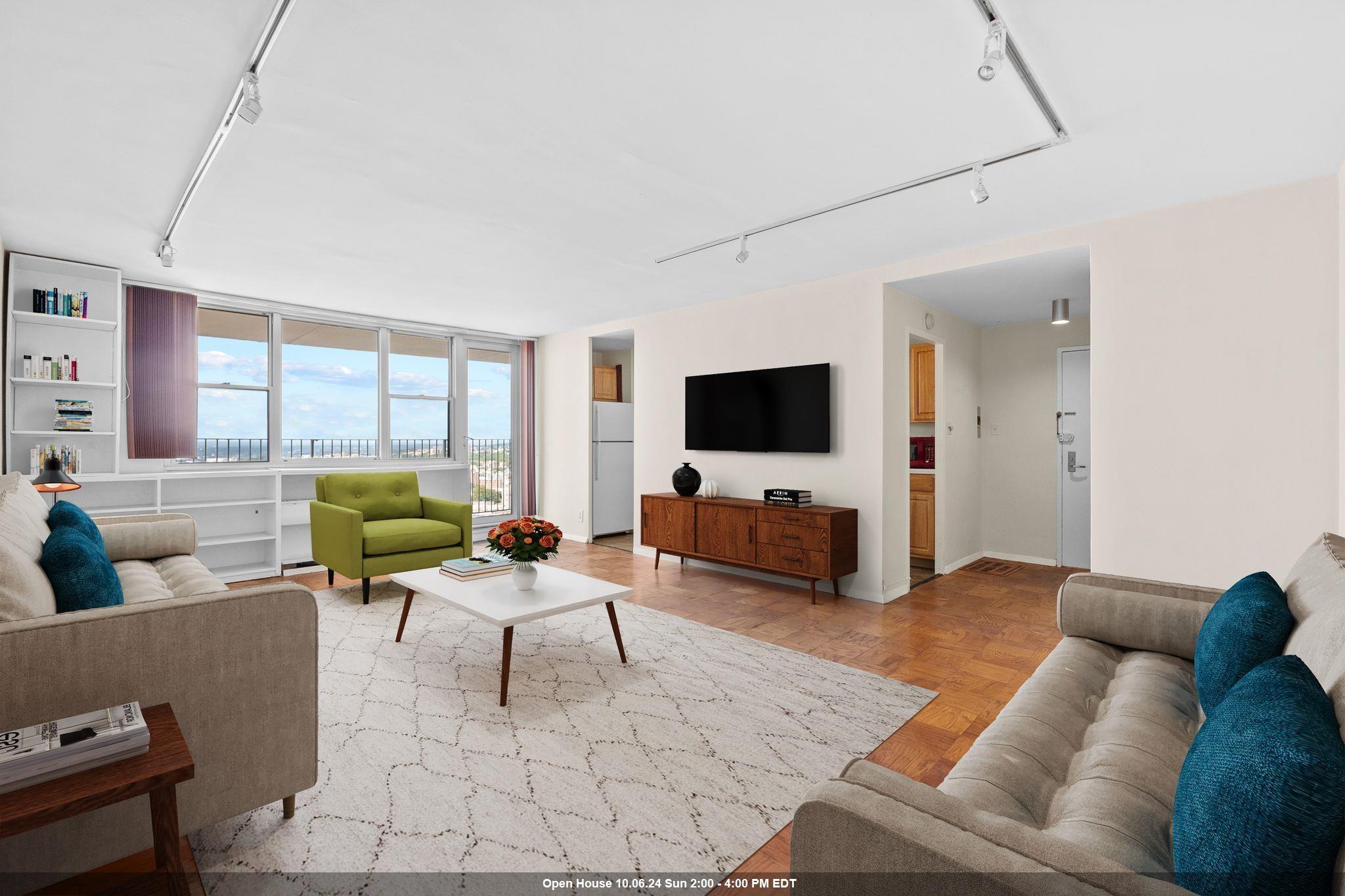 a living room with furniture and a flat screen tv