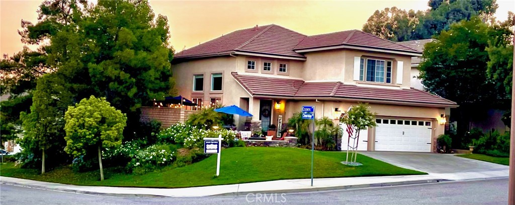 a view of a house with a small yard and plants