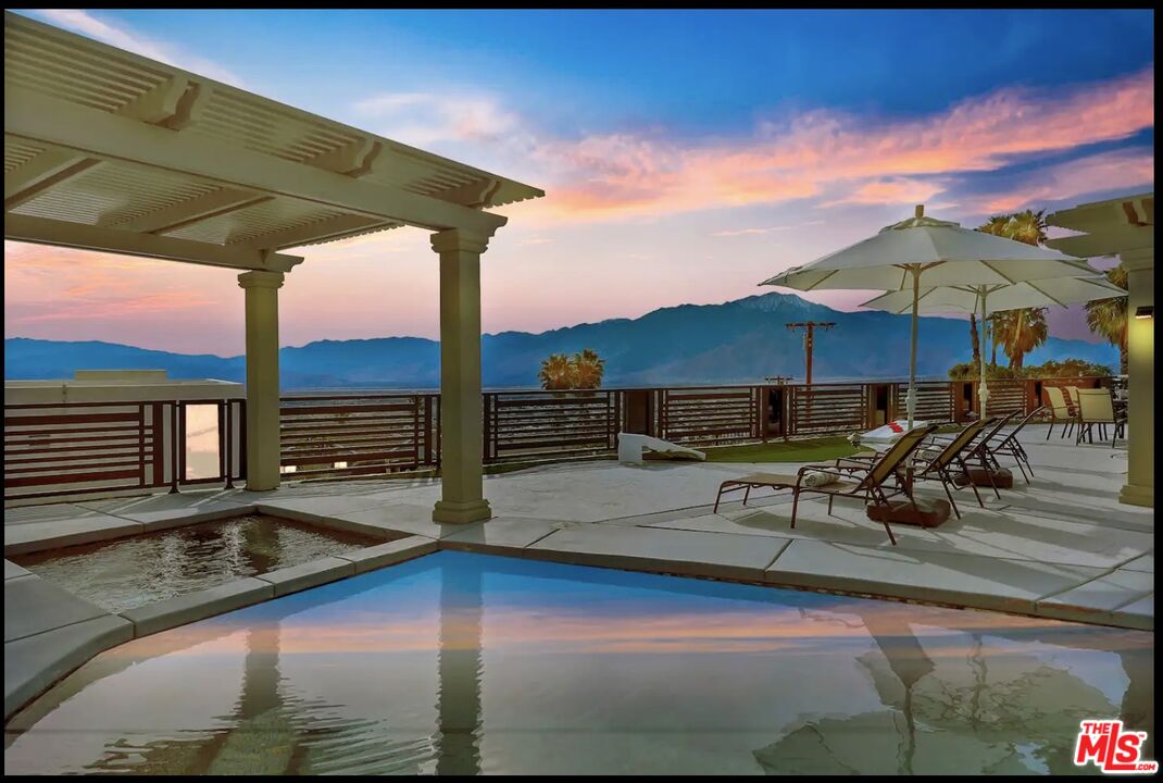 a view of a swimming pool with a lounge chair