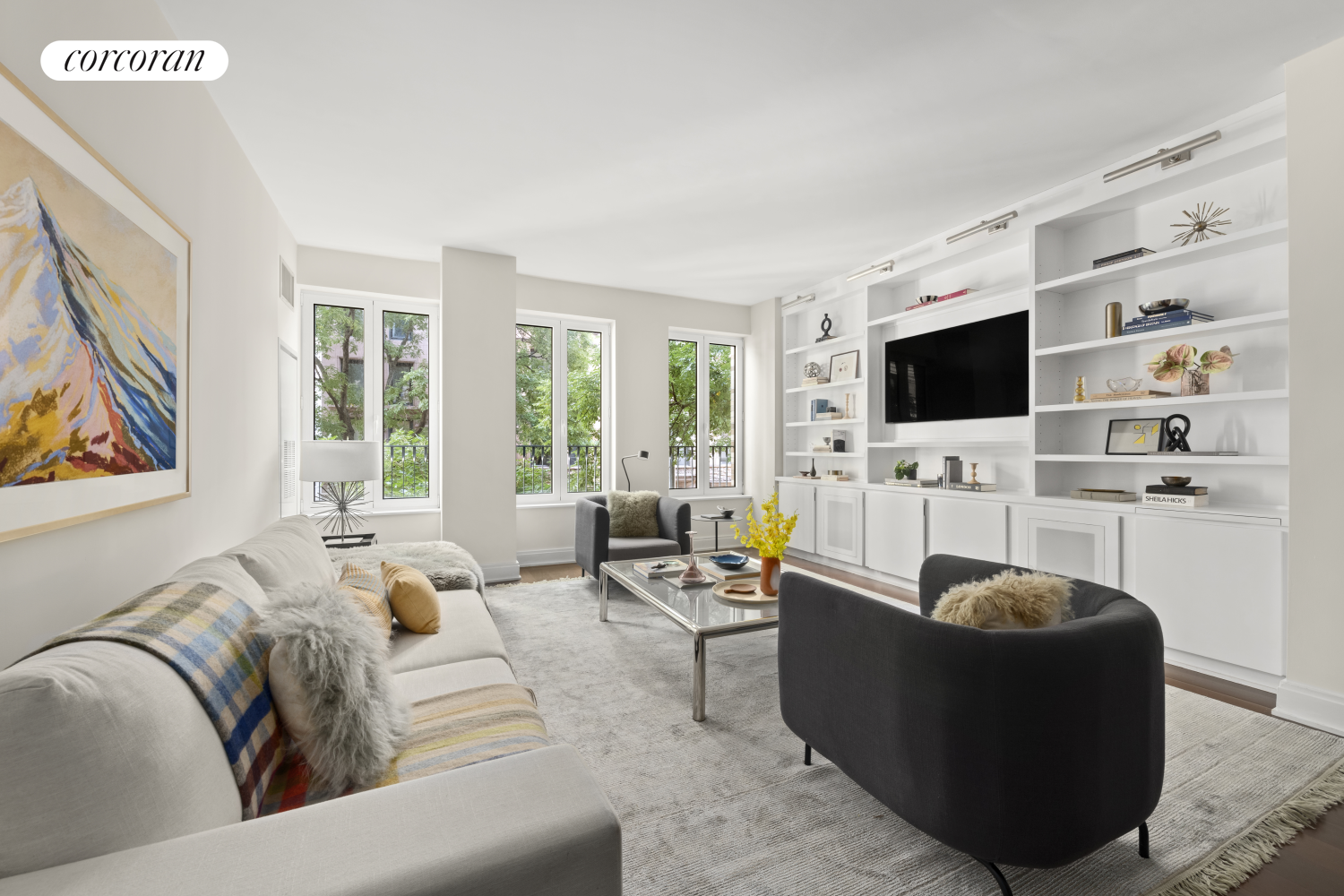 a living room with furniture and a flat screen tv