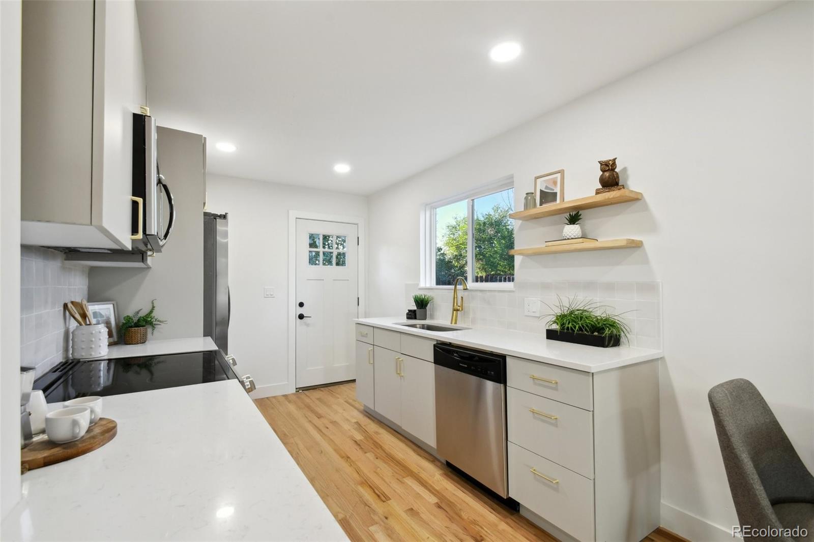 a kitchen with a sink and cabinets