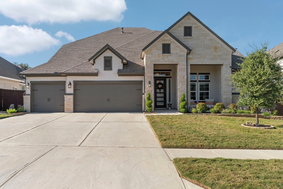 front view of a house with a yard