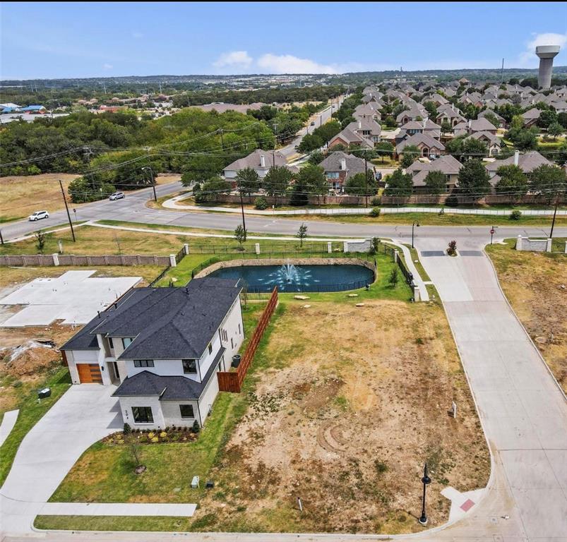 an aerial view of a house with a swimming pool