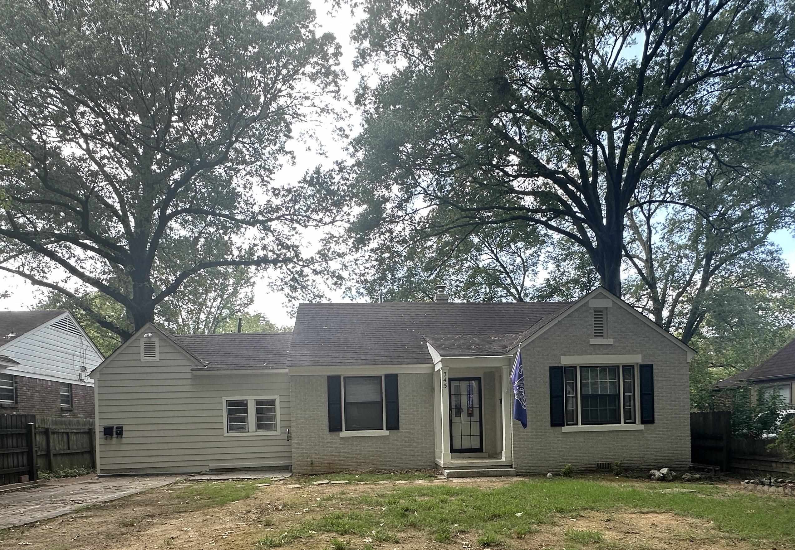 front view of a house with a yard