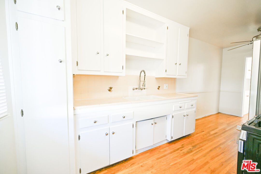 a spacious bathroom with a sink double vanity and mirror