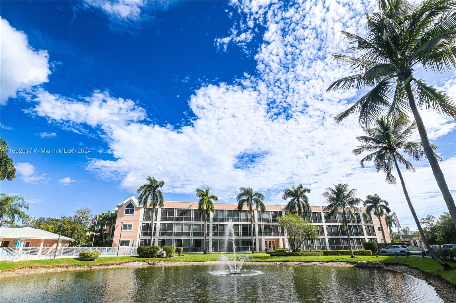 a view of a lake with a building in the background