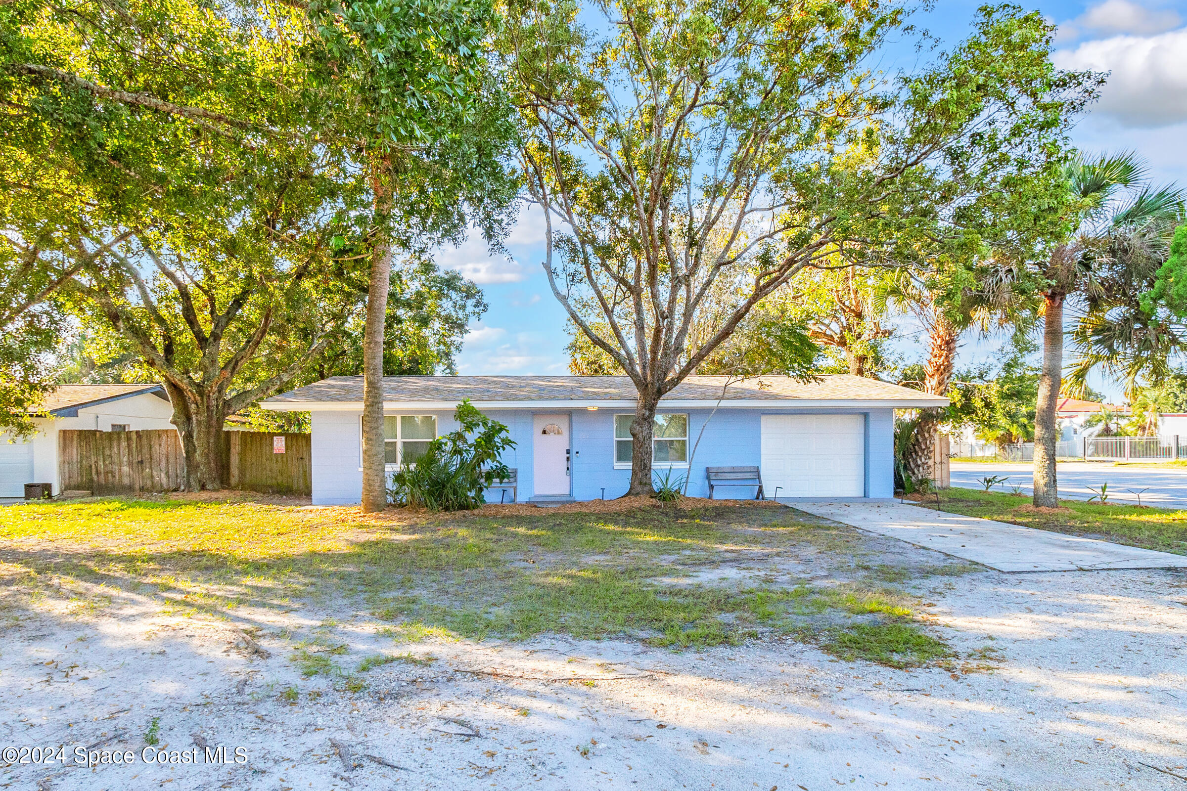 front view of a house with a yard