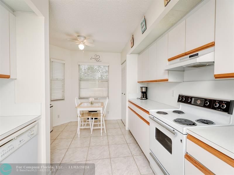 a kitchen with a stove a sink and a refrigerator