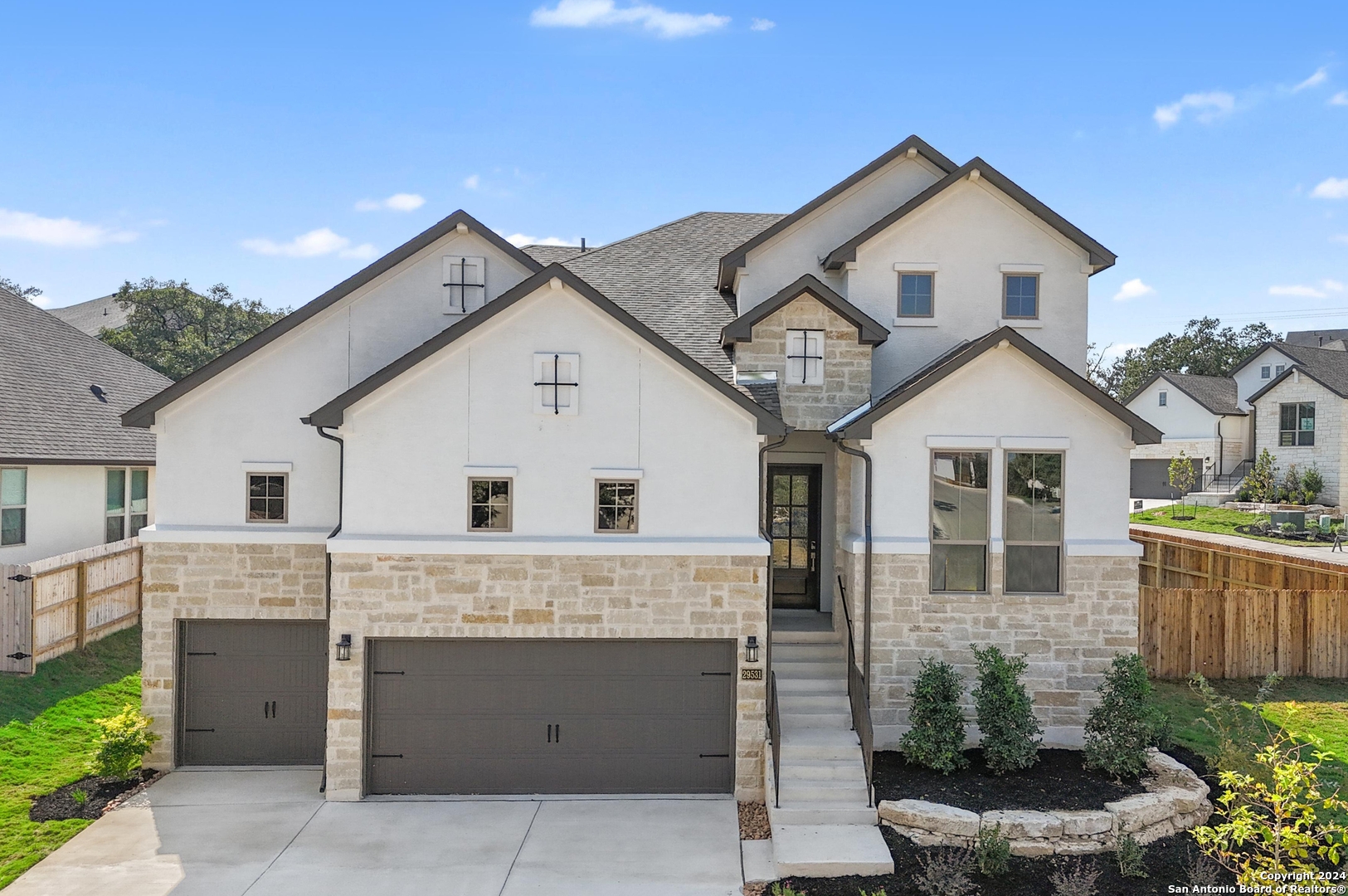 a view of a house with a yard and garage