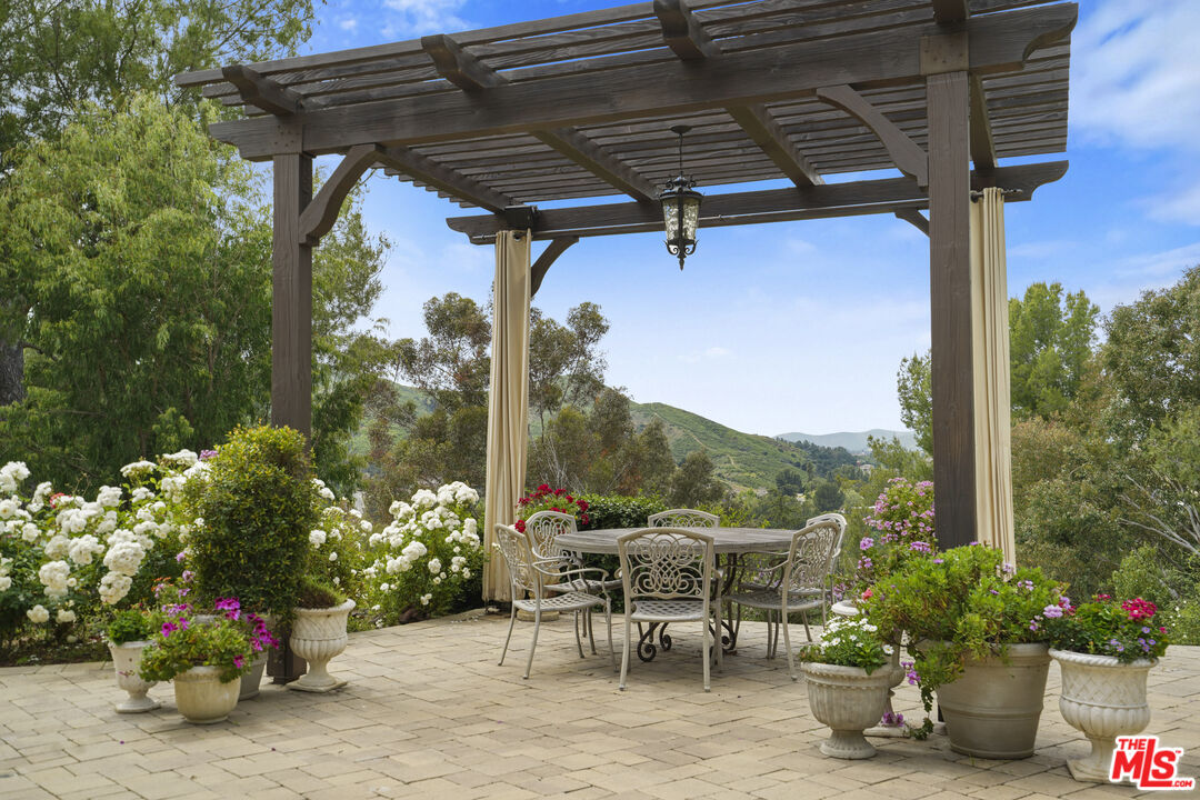 a view of a chairs and table in the patio