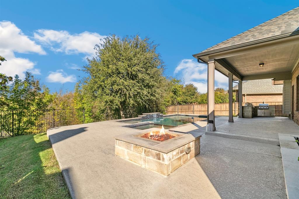 a view of a swimming pool with a patio