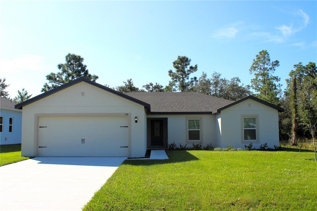 a view of a house with a yard