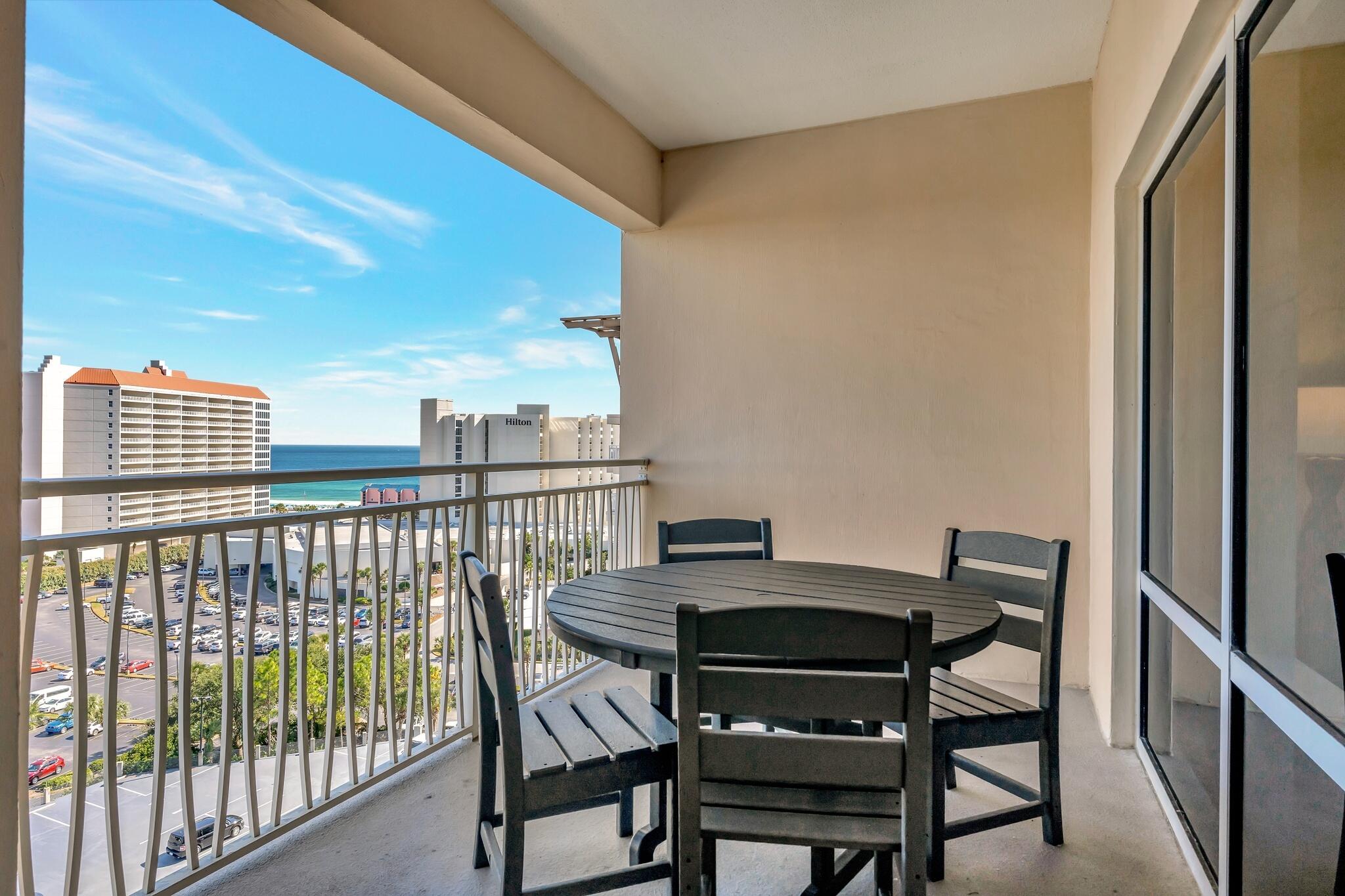 a view of a balcony with furniture