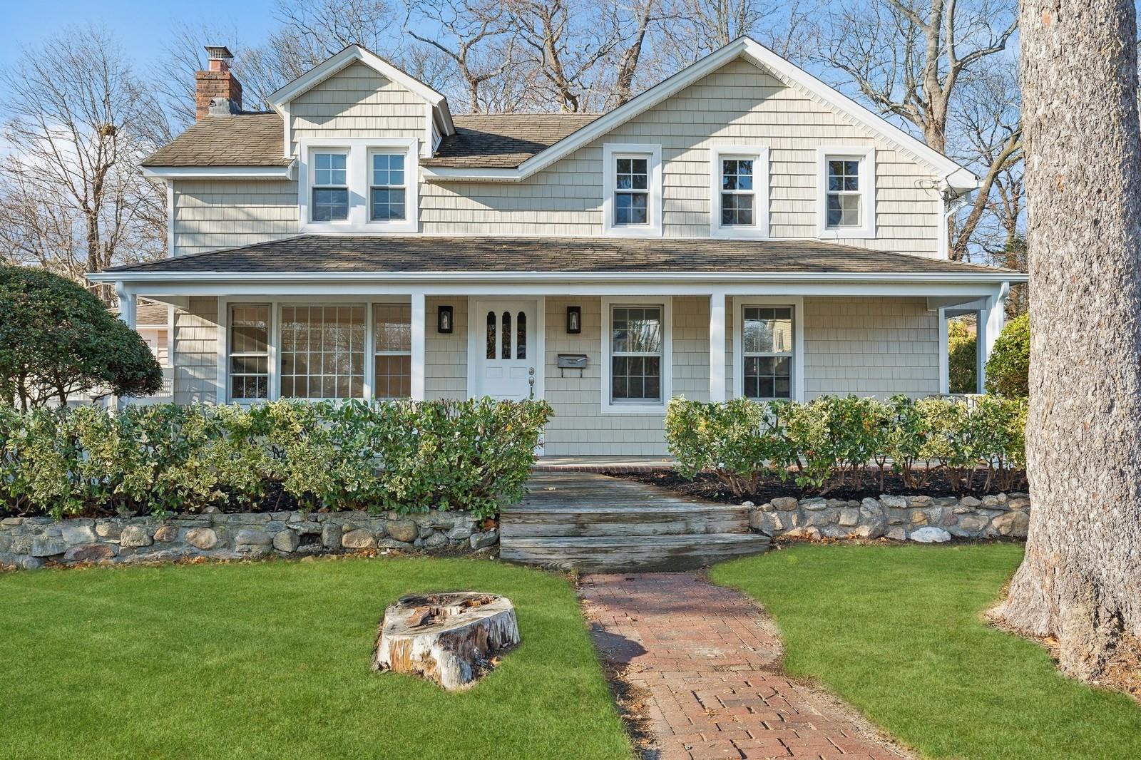 Farmhouse inspired home featuring a front yard