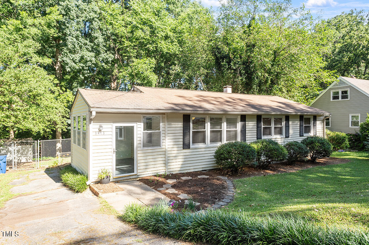 a front view of a house with a yard and porch