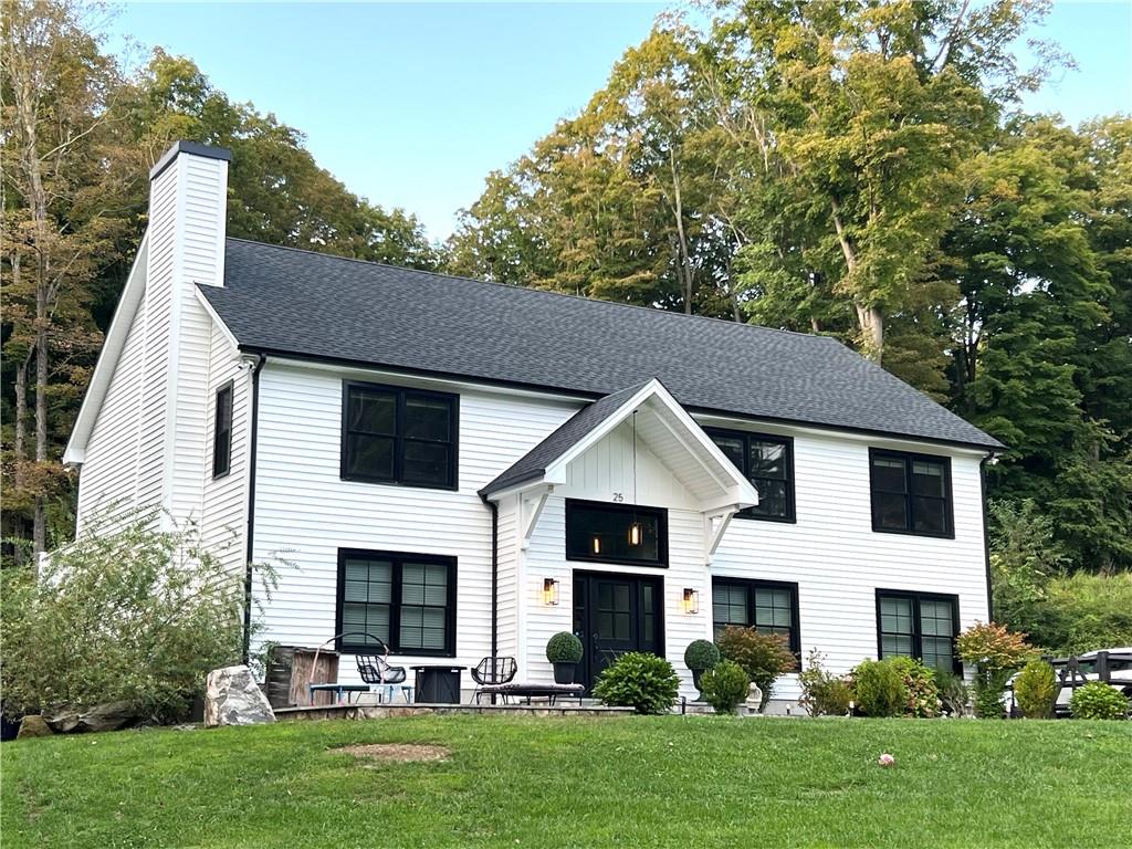 View of front of property with a front yard