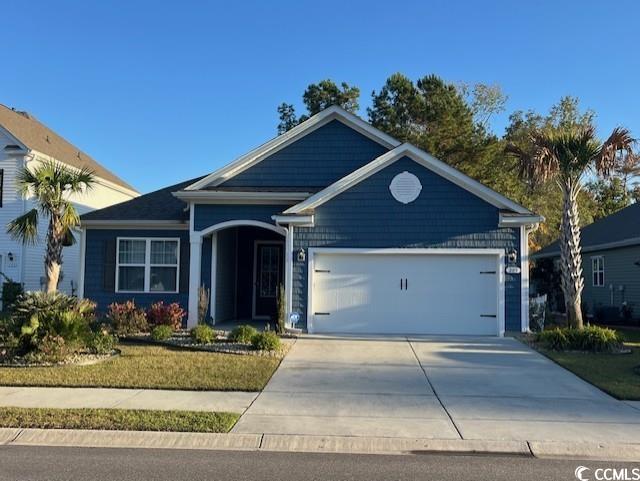 View of front of home with a garage