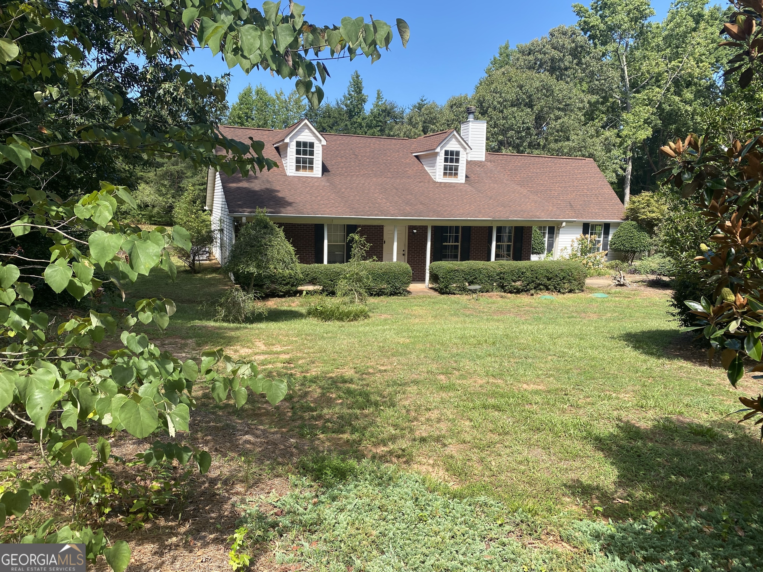 a front view of a house with garden