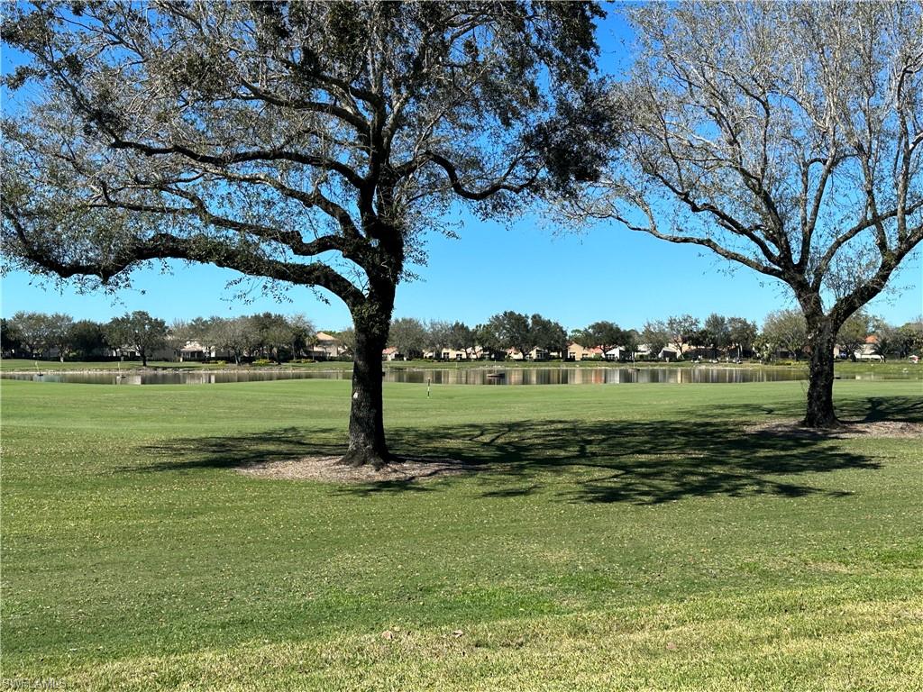 a view of a golf course with a lake