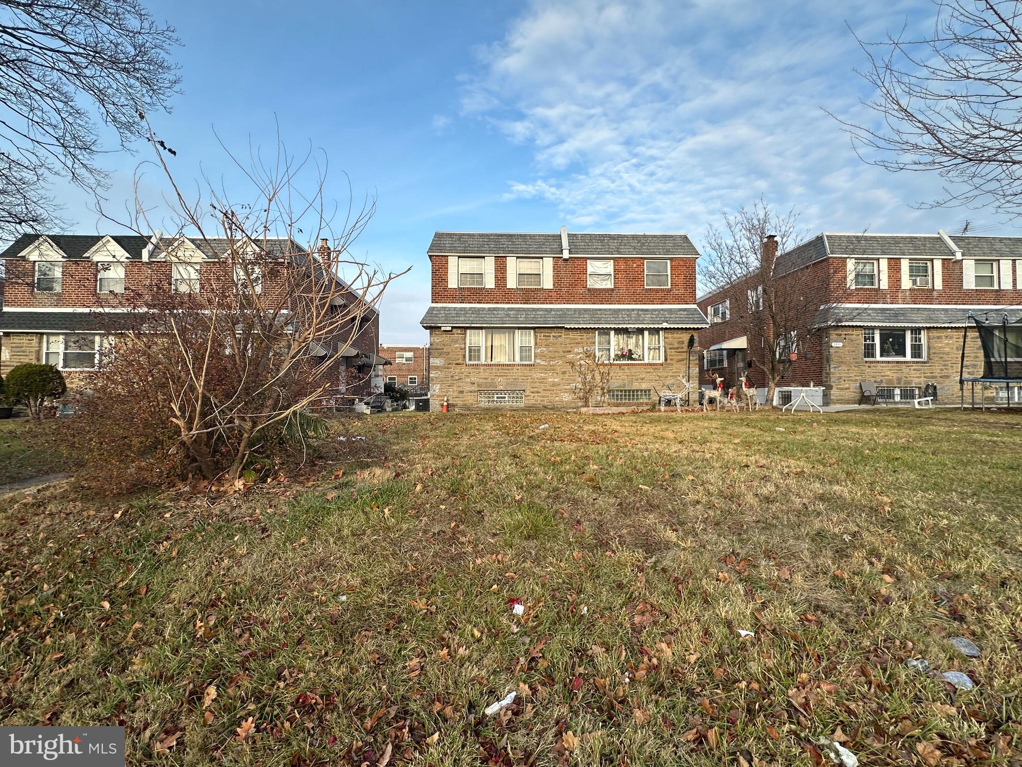 a front view of residential houses with yard