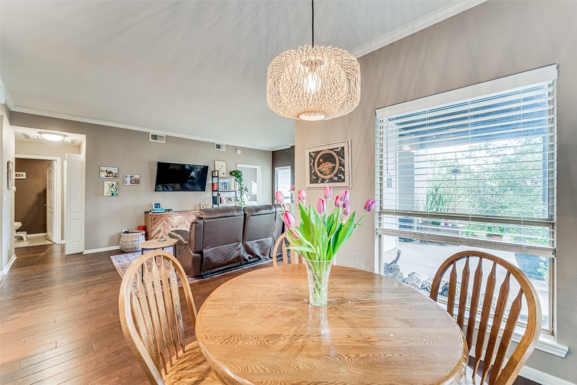 a dining room with furniture a livingroom and chandelier