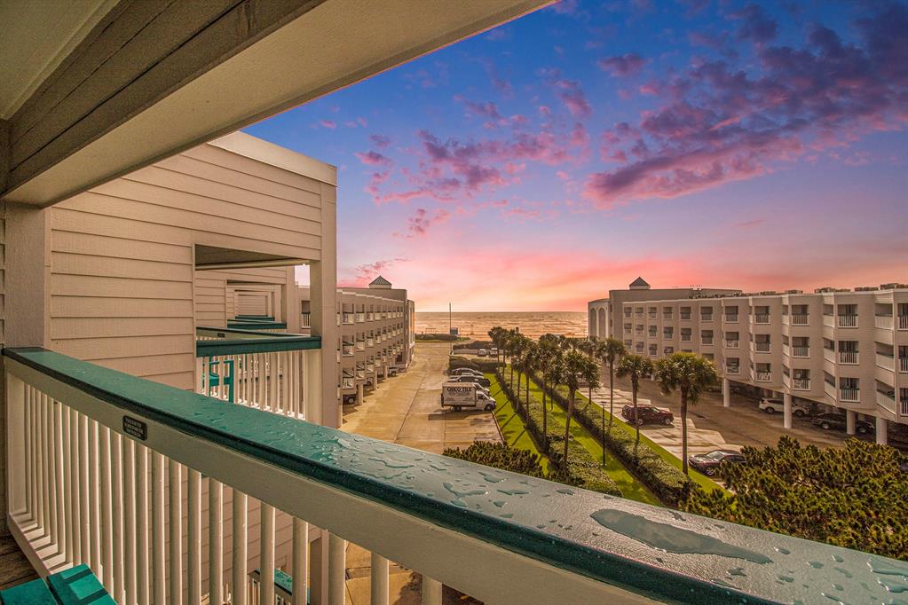 a view of a balcony with an ocean view