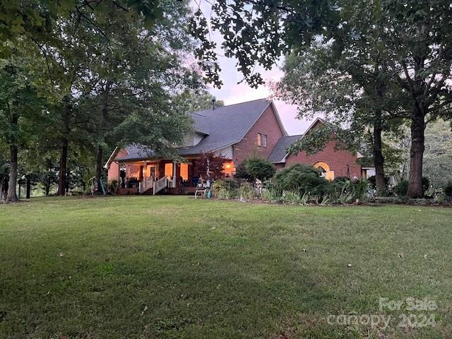 a view of a big yard with a house