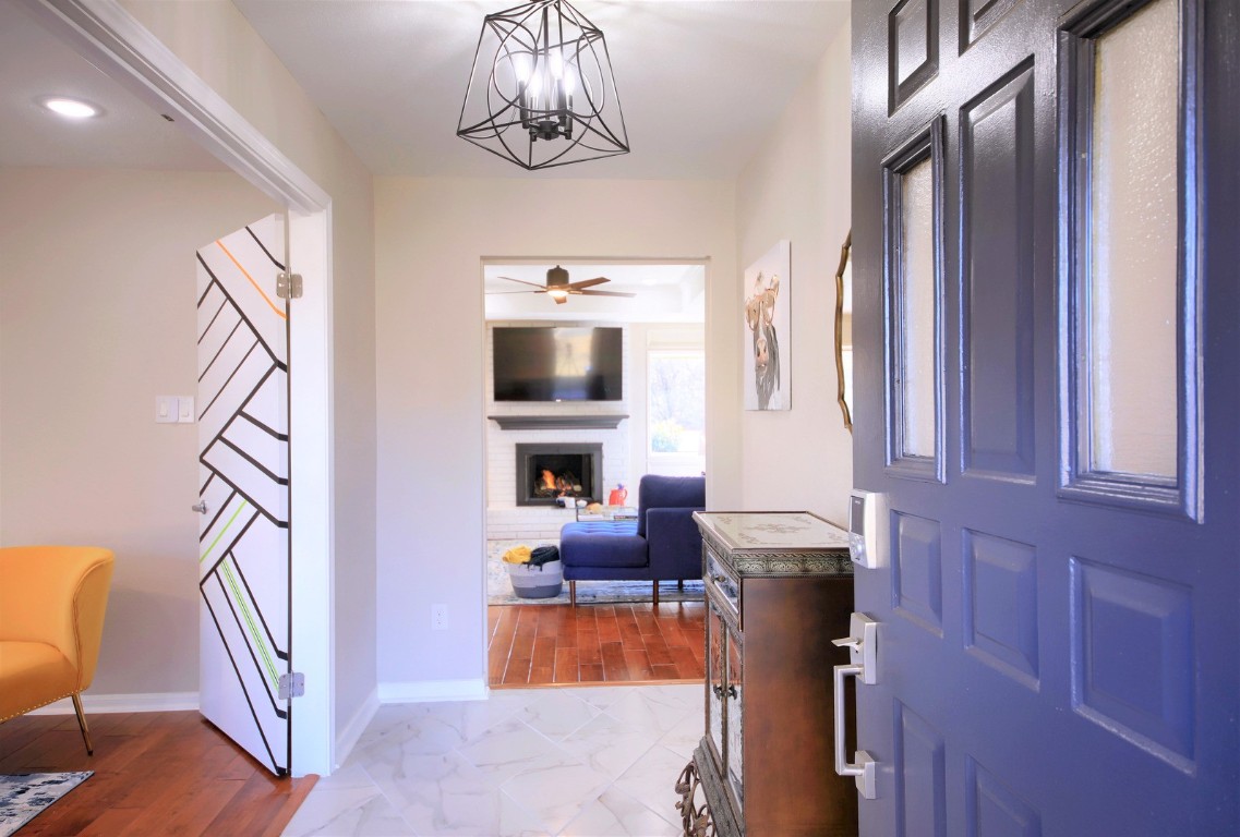 a bedroom with furniture and a chandelier