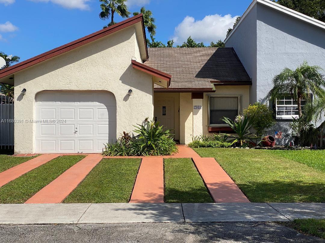 a front view of house with yard