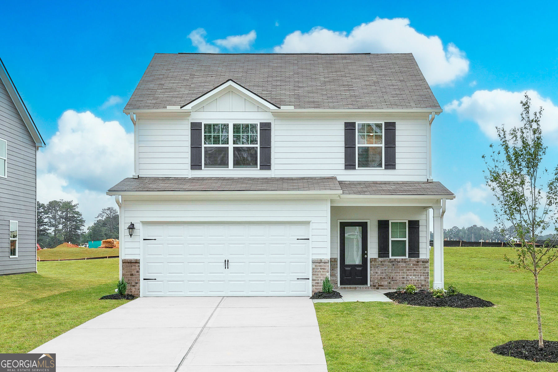 a front view of a house with a yard