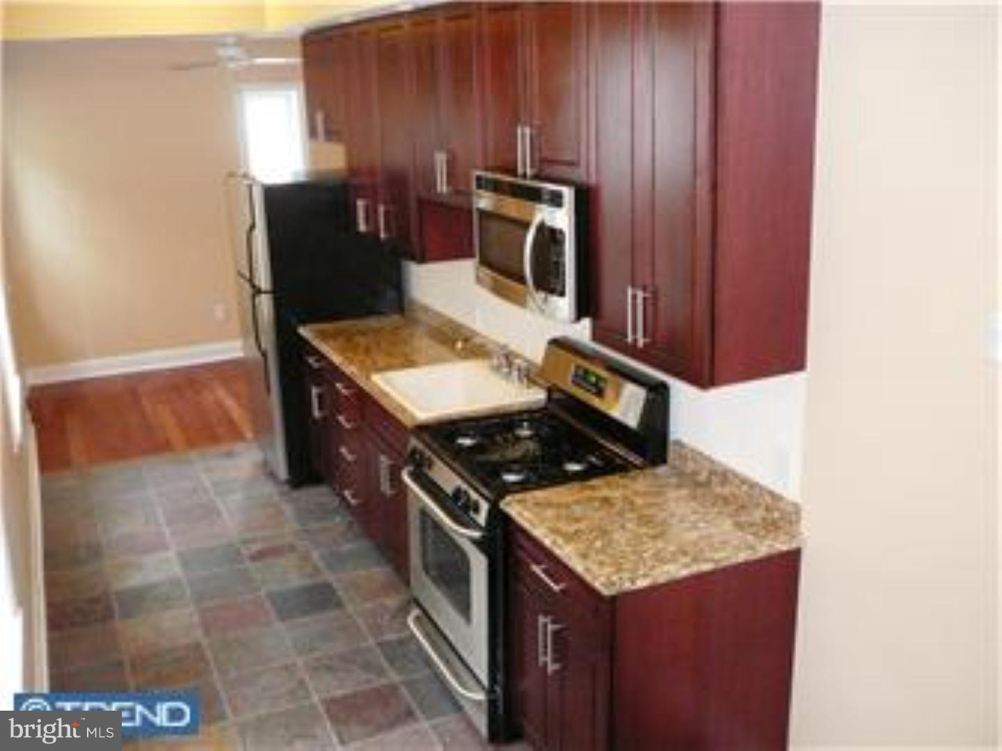 a kitchen with a stove and a microwave