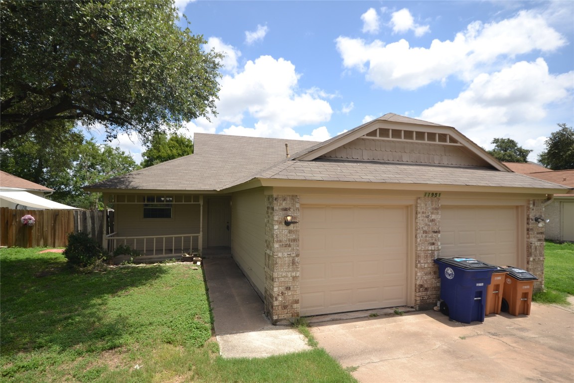 front view of a house with a yard