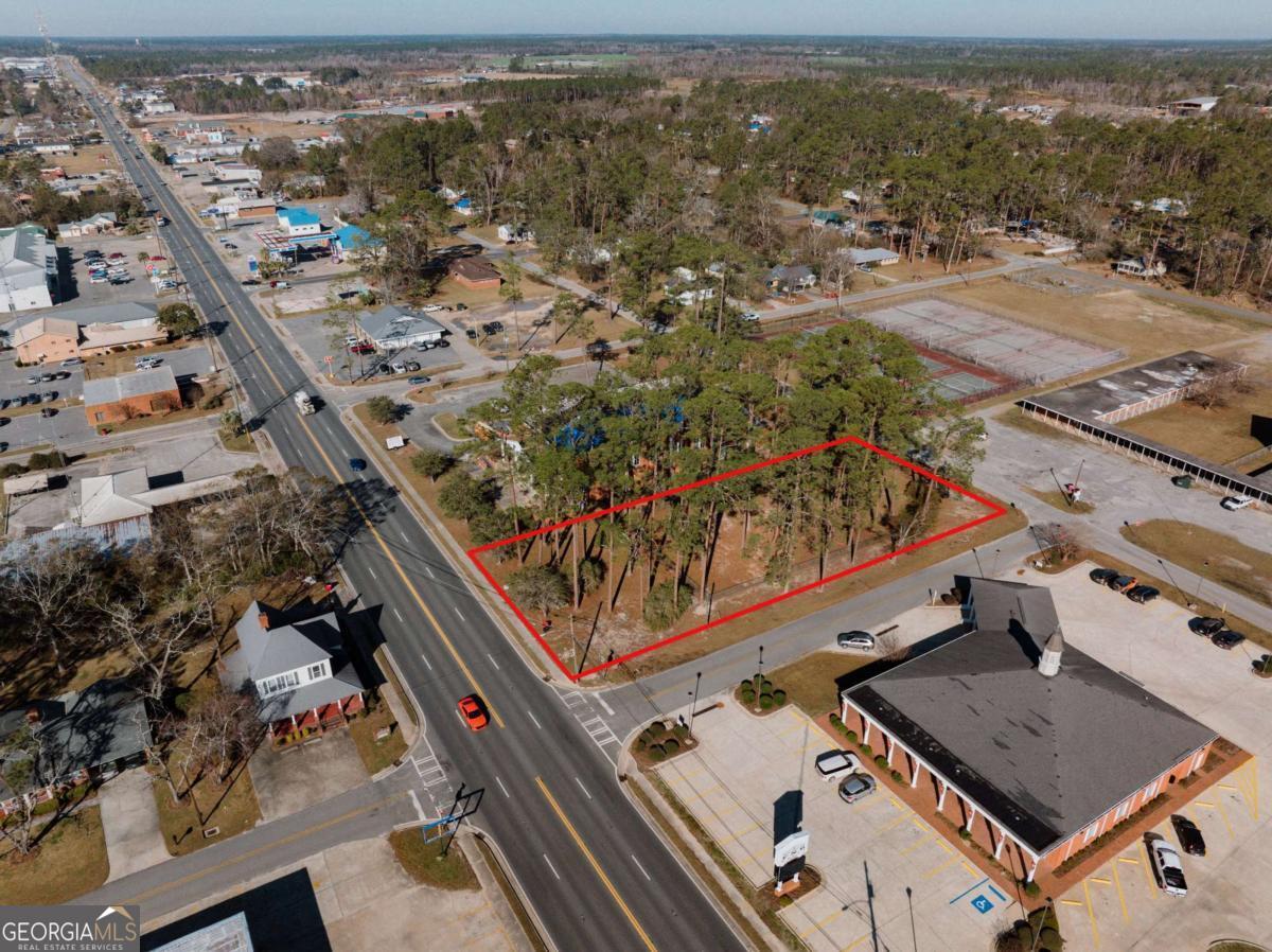 an aerial view of a residential houses with outdoor space