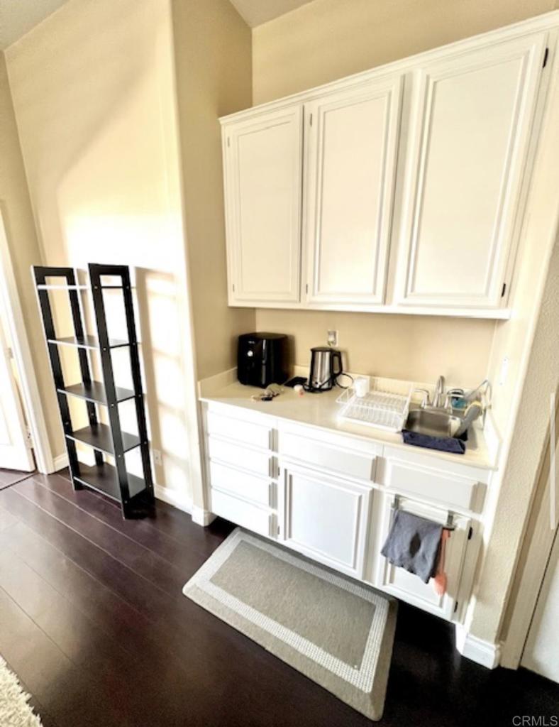 a view of a kitchen with a sink and a window