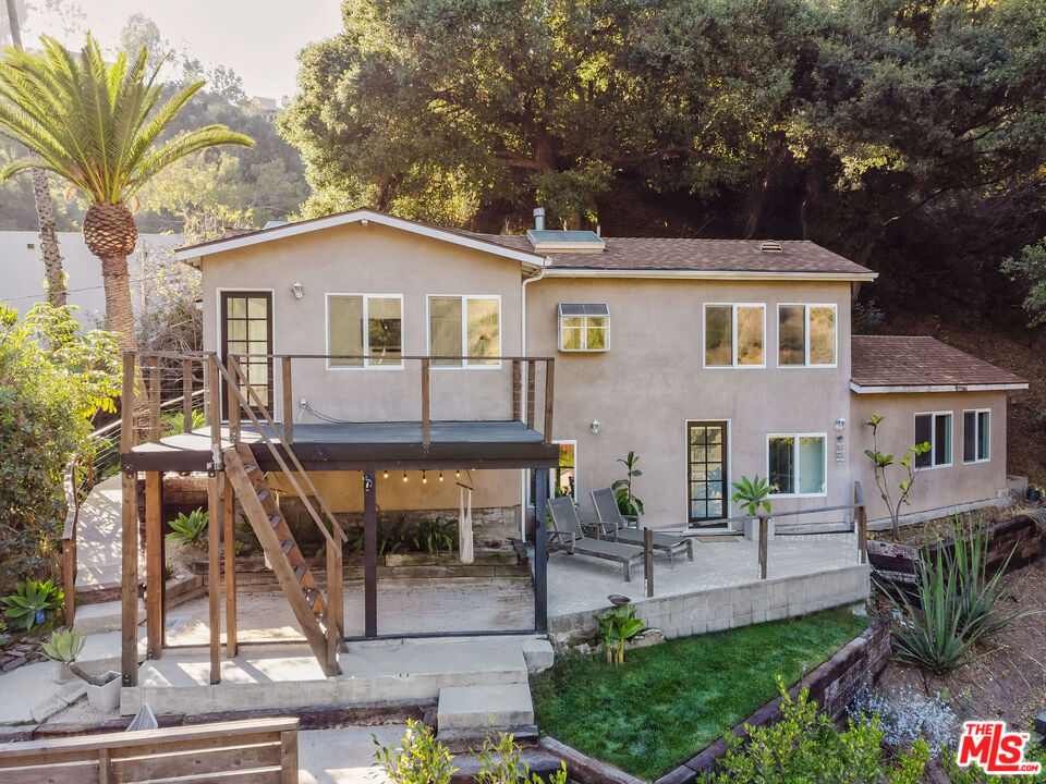 a view of house with yard outdoor seating and green space