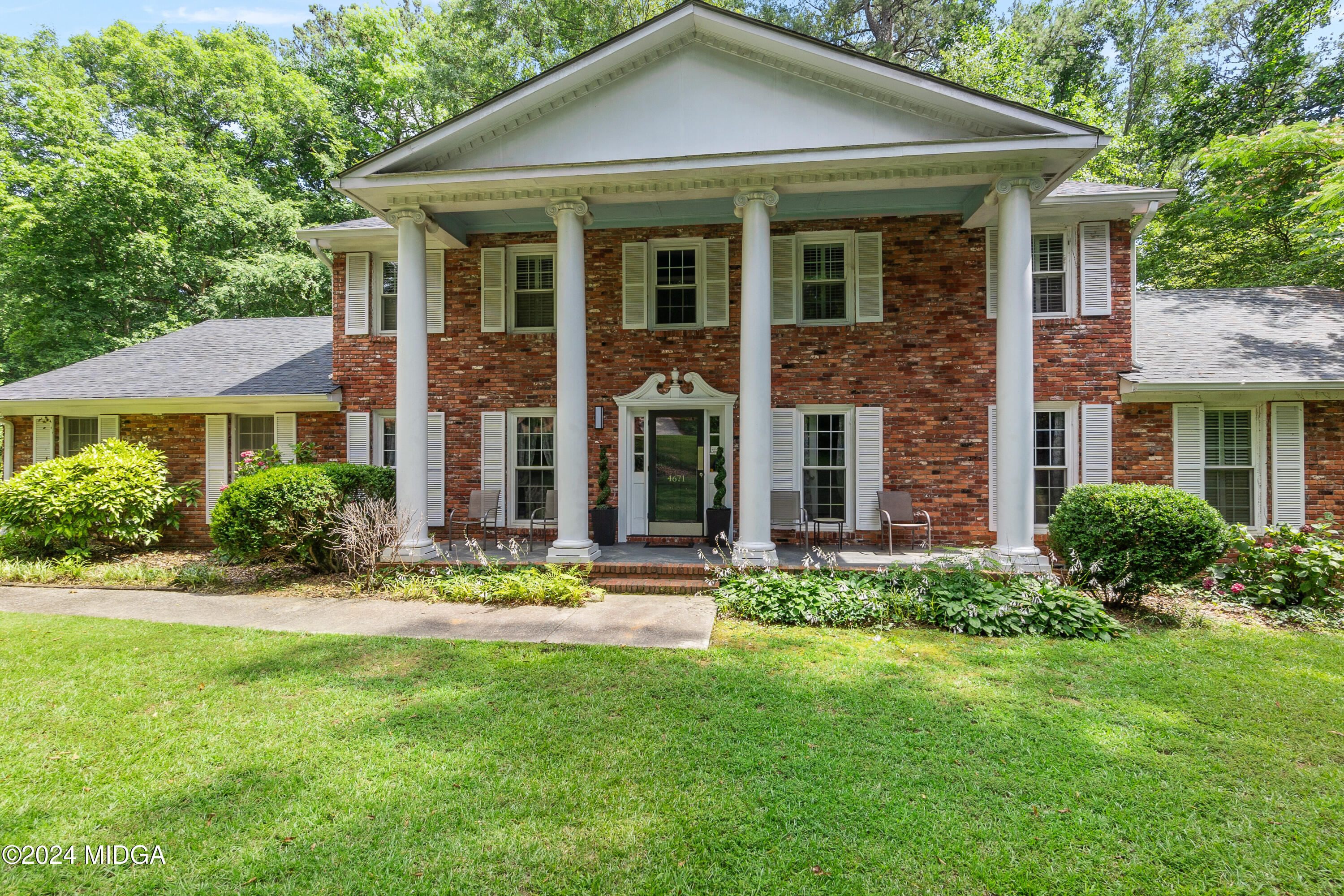 front view of a house with a yard