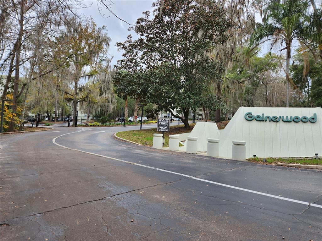 a view of fountain with tree in the background