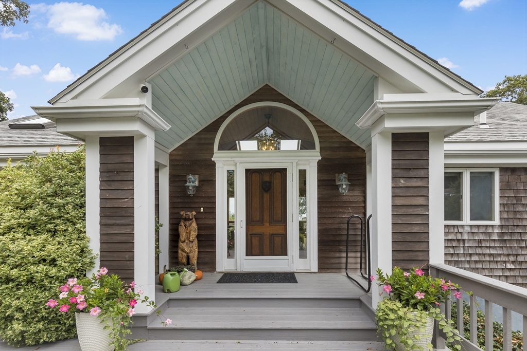 a front view of a house with a garden