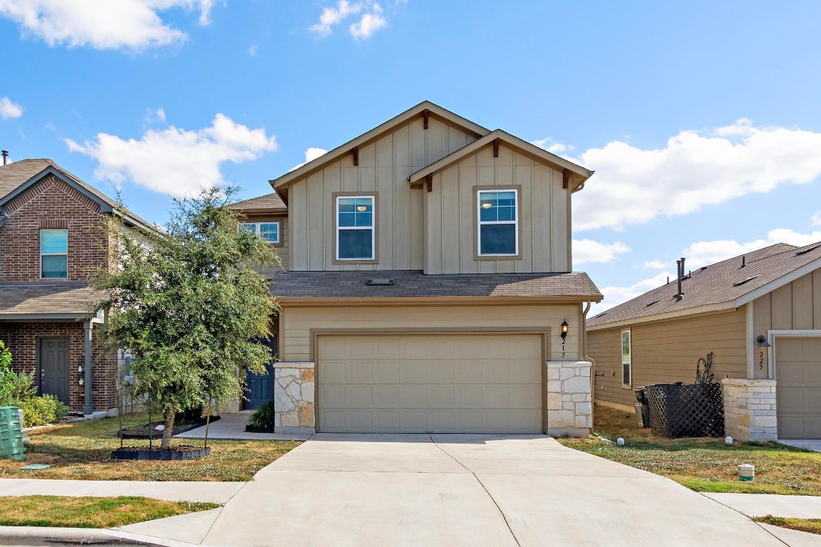 a front view of a house with a garage