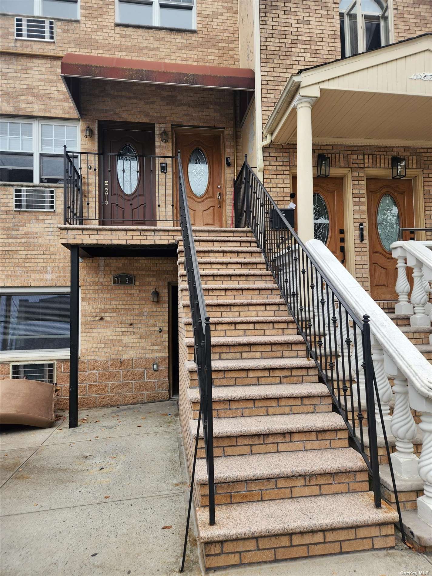 a view of a house with entrance and stairs