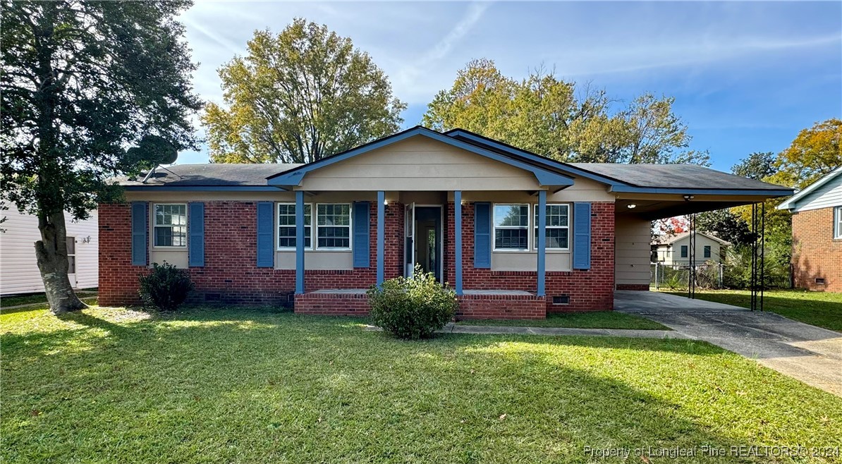 a front view of a house with a garden and porch