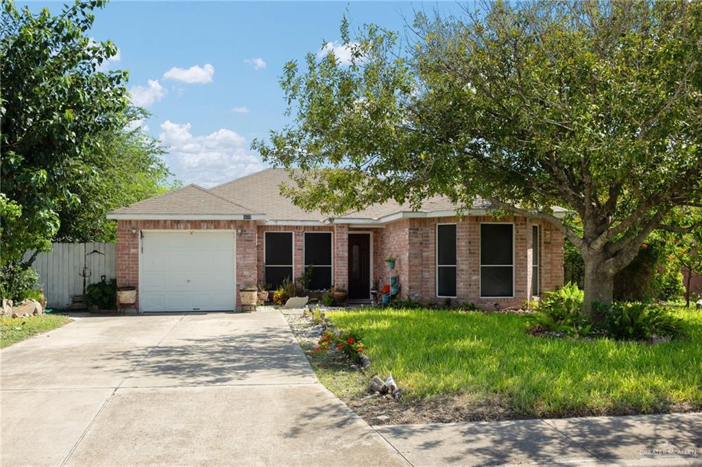 Single story home featuring a garage