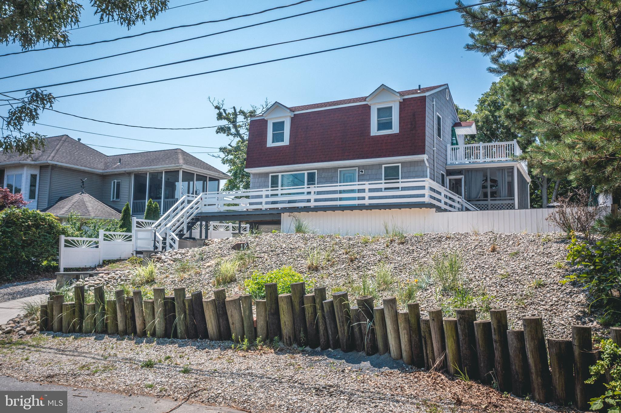 a view of a house with wooden fence